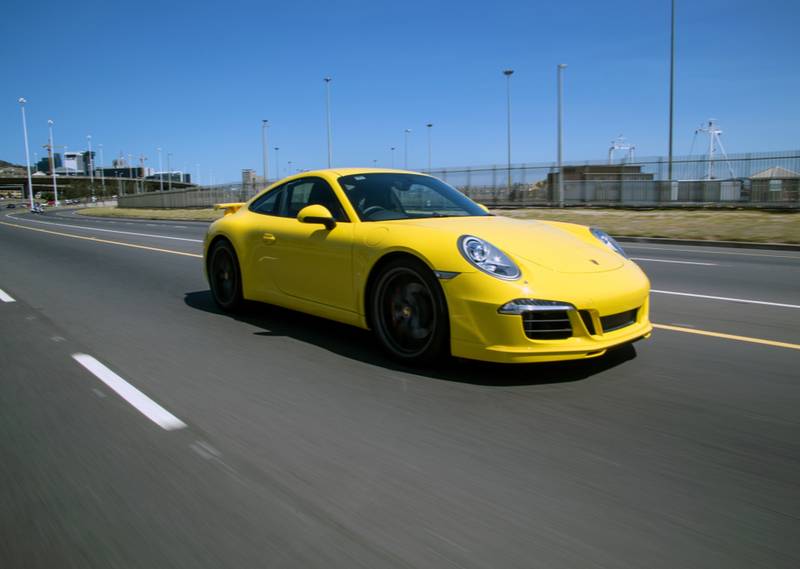 Yellow Porsche 911 speeding away